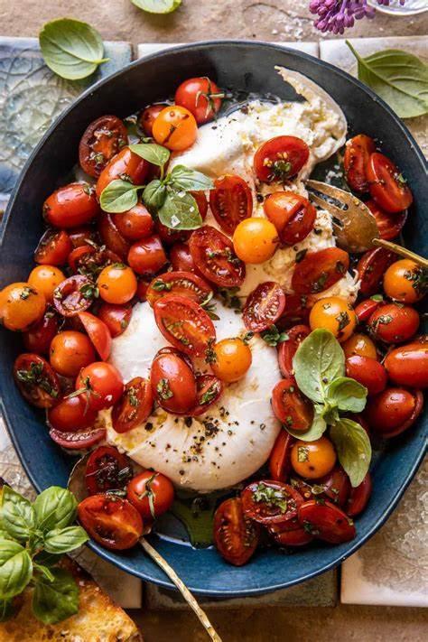 Fresh burrata cheese with roasted cherry tomatoes, basil, and olive oil drizzle