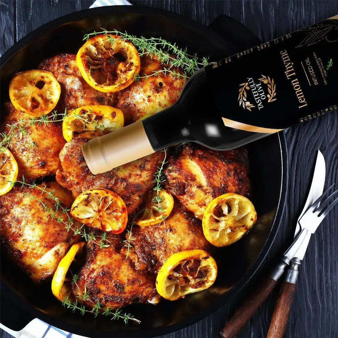 Lemon Thyme infused olive oil drizzled over roasted chicken with lemon slices and fresh thyme