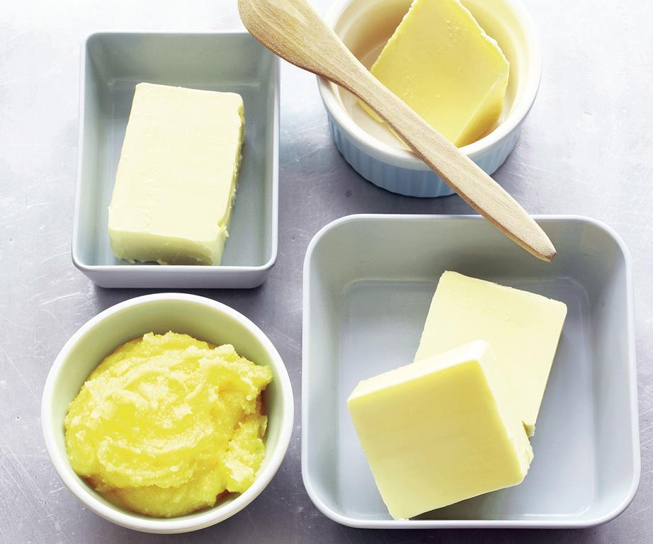 Butter in bowls and dishes, soft and solid forms for cooking and baking